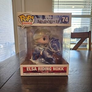 Elsa riding Nokk Funko Pop